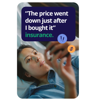 woman lying on her bed looking at her phone