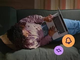Person using a laptop at home, representing how to identify online scams