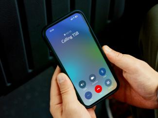 Smartphone displaying an incoming call, representing scam phone calls