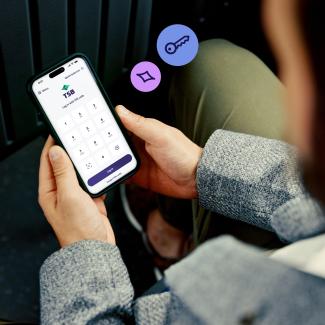 Smartphone displaying TSB mobile banking app used for secure login and account access