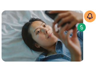 Lady relaxing looking at her TSB mobile banking app