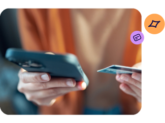 Hands holding a smartphone and TSB card checking their banking account