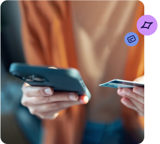 Hands holding a smartphone and TSB card checking their banking account