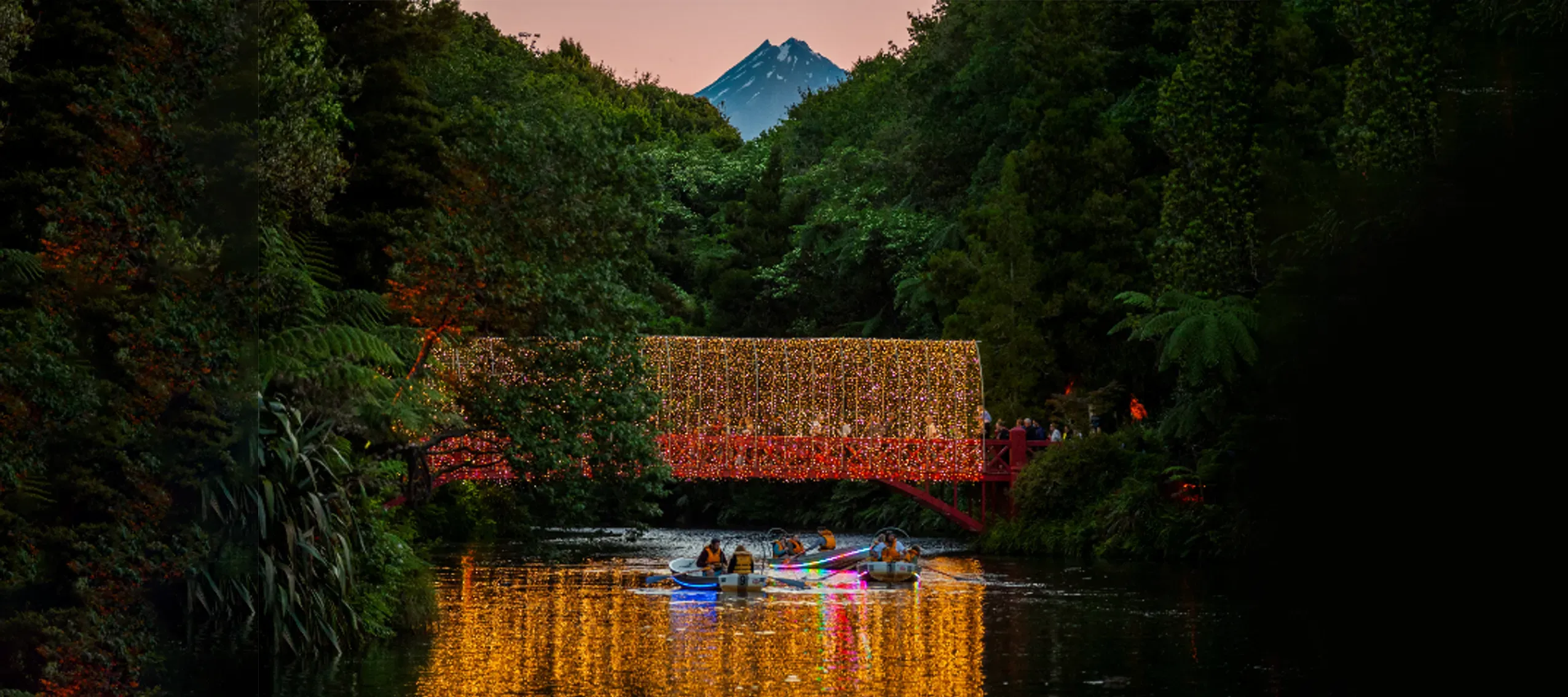 Taranaki festival of lights, boats in front of the bridge