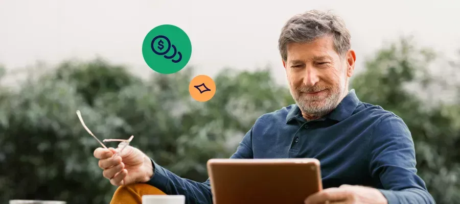 Man using a laptop to review investment options