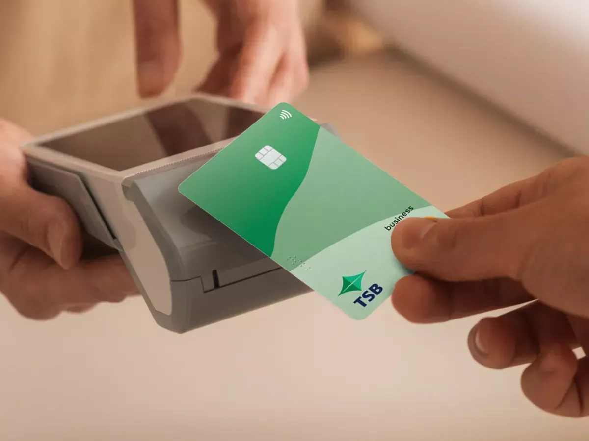 Customer making a contactless card payment using a payment terminal