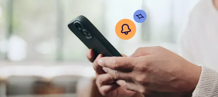 Person holding a smartphone, looking at a TSB overdraft to manage expenses