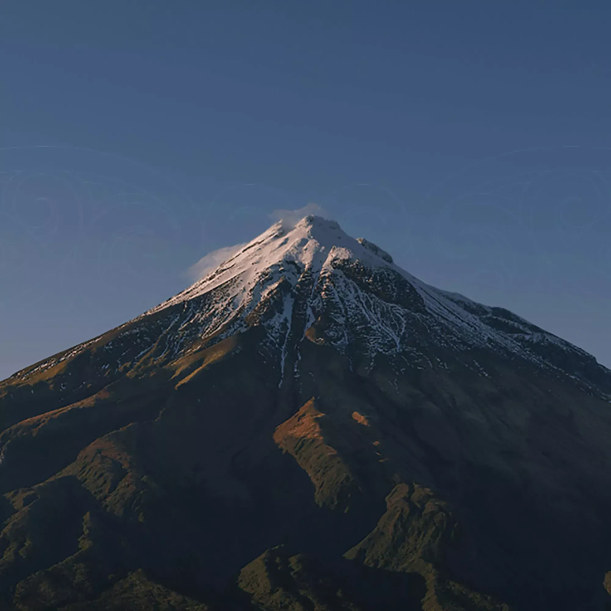 Mount Taranaki viewed from above beneath a clear sky