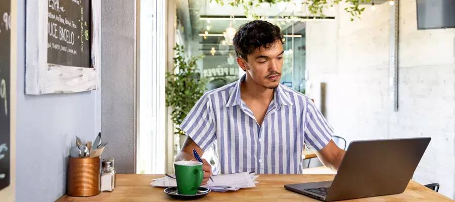 Business owner managing income, expenses and payments from a business account.